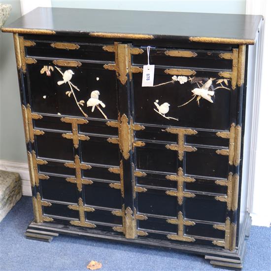 A Japanese lacquer panelled and ivory mounted cabinet W.80cm approx.